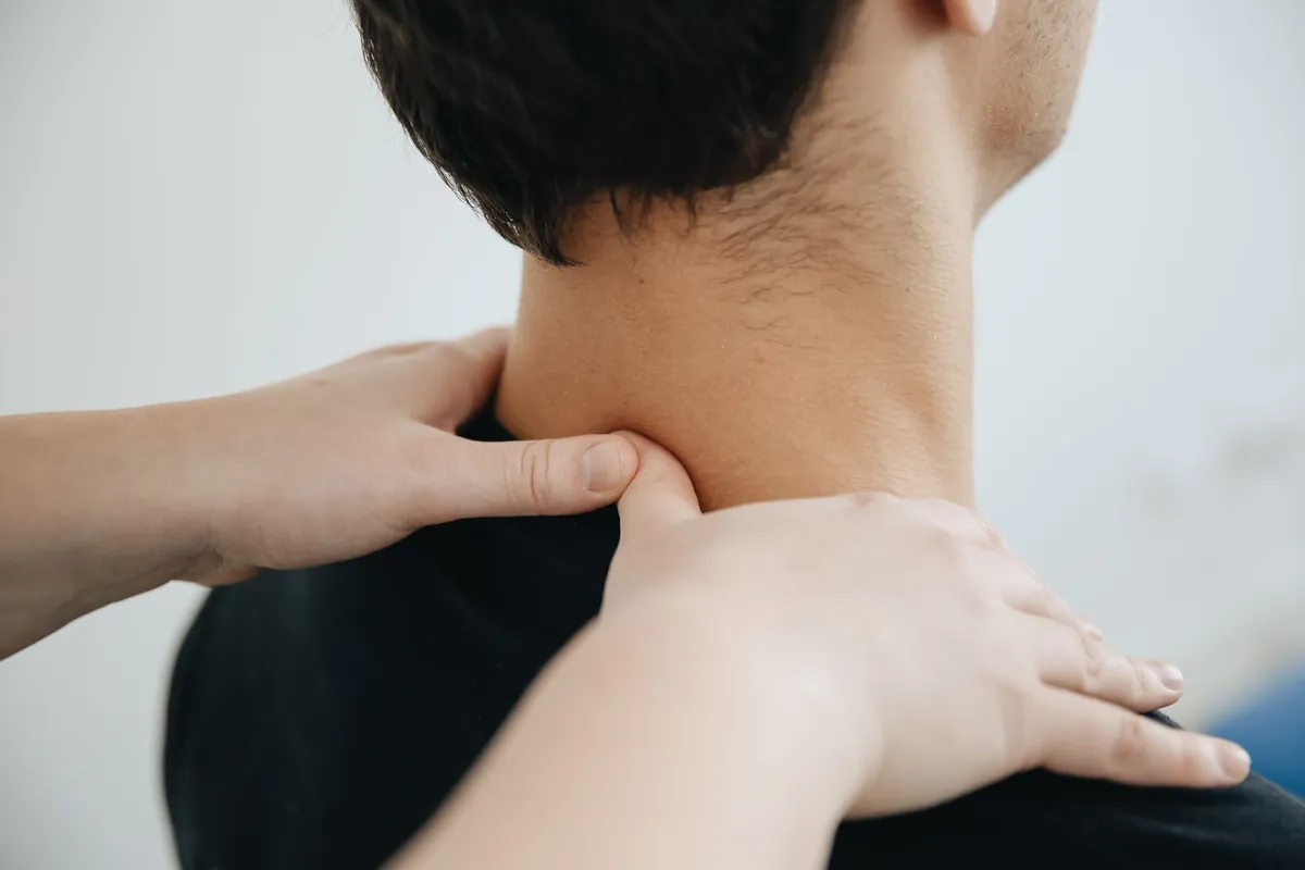 Thumb pressure on the neck and upper shoulder during massage for back and neck pain in Salt Lake City